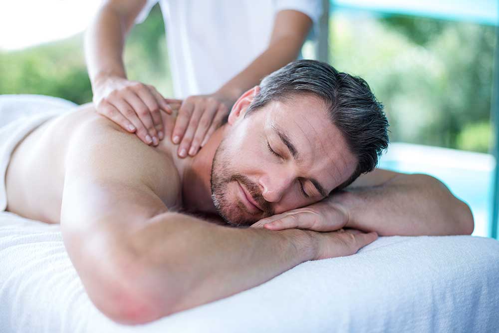 Kumpang Thai Massage man receiving back thai massage from masseur